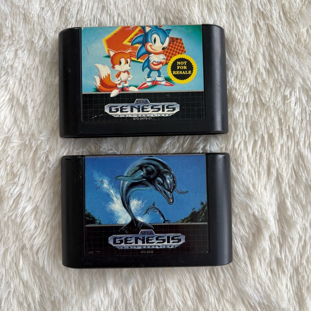 Sonic the Hedgehog 2 and Ecco the Dolphin for Sega Genesis.